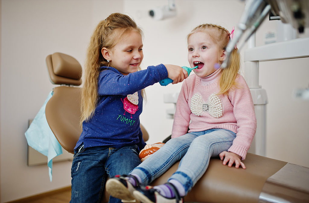 Kids brushing and whitening teeth