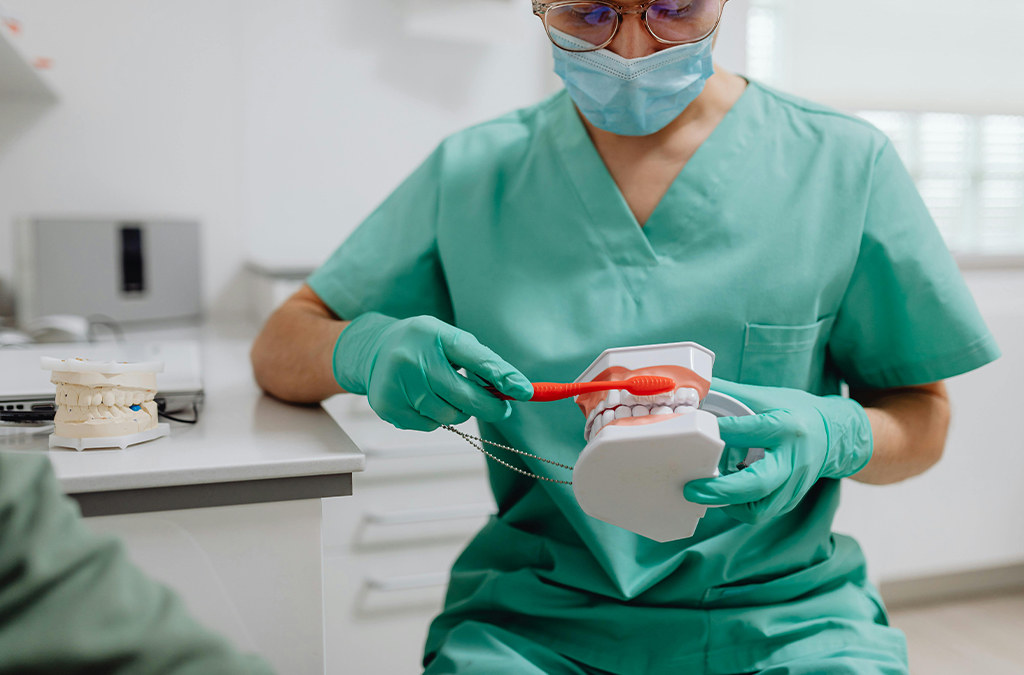 Person brushing teeth with a soft-bristled toothbrush