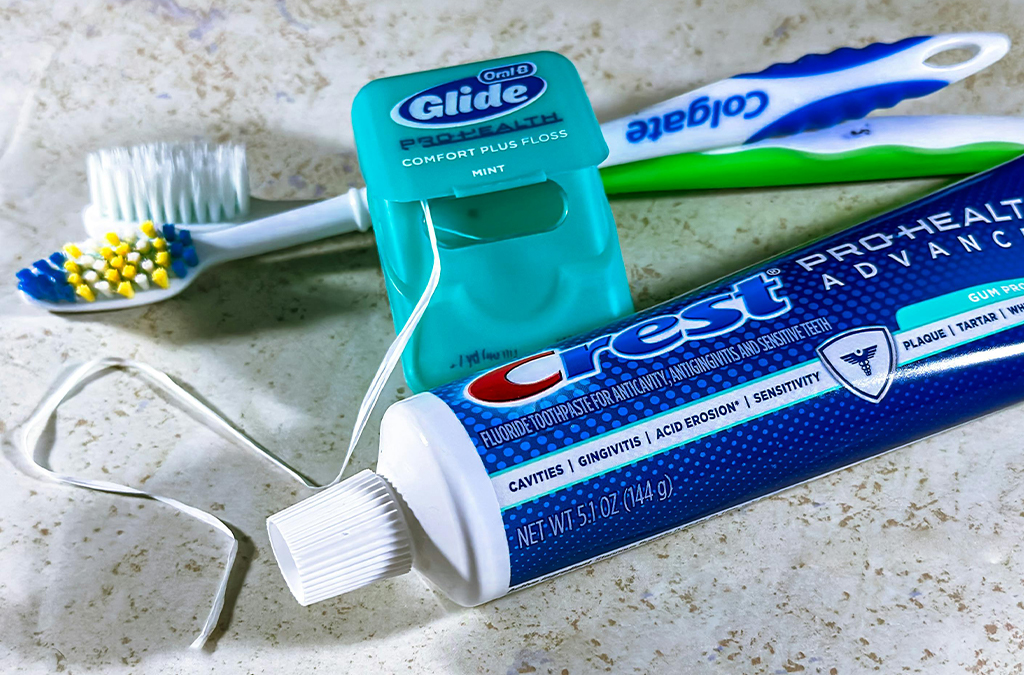 toothpaste with brush to improve and maintain oral hygiene